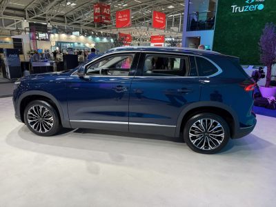 Side profile of a 2023 SUV with alloy wheels and modern design