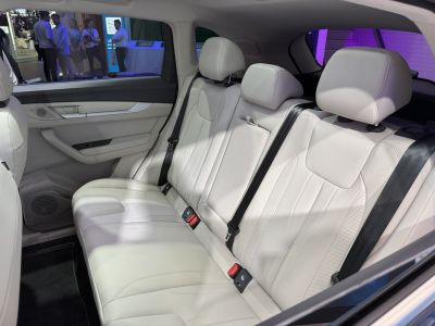 White leather rear seats with headrests and seat belts