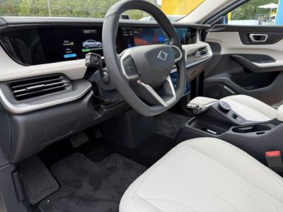 Modern digital dashboard and steering wheel with premium seating