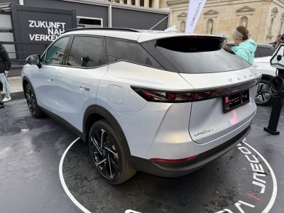 Rear side view with sleek LED taillights and black roof