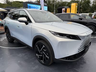 Futuristic front grille with sleek LED headlights and black alloy wheels