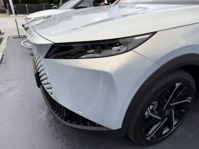 Close-up of front headlight and alloy wheel on a modern vehicle