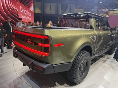 Rear and side view of off-road pickup with LED tail lights and rugged tires
