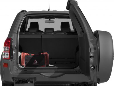 Open rear cargo space with swing-out spare tire and folded rear seats
