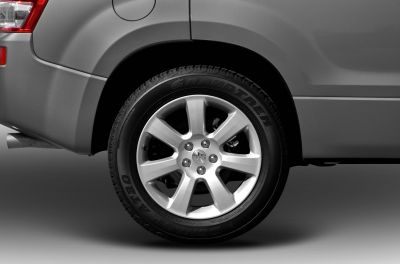 Rear alloy wheel with Grandtrek tire on SUV
