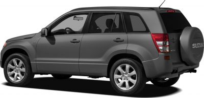 Rear side view of 3-door SUV with spare tire mounted on tailgate