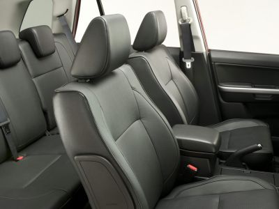 Black leather ergonomic seats with detailed stitching in a 3-door SUV interior