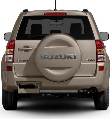 Rear view of SUV with spare tire on tailgate and taillights.