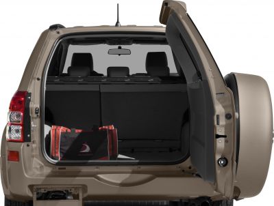 Open SUV rear cargo space with side-hinged tailgate and tool bag