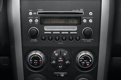 Car audio system and automatic climate control panel with tuning and temperature knobs