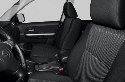 Front seats, door panel, steering wheel, and center console close-up view