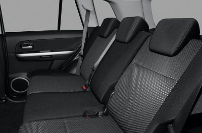 Rear seat interior with fabric upholstery and seat belts