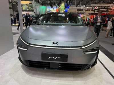 Sleek electric sedan front with distinctive LED lighting