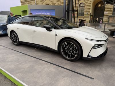 Sleek electric sedan with aerodynamic design and alloy wheels