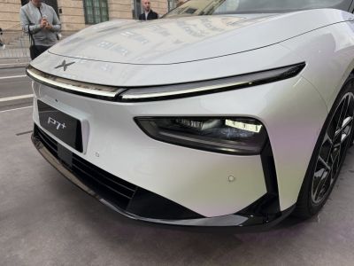 Front LED headlights and aerodynamic design of a sleek white vehicle