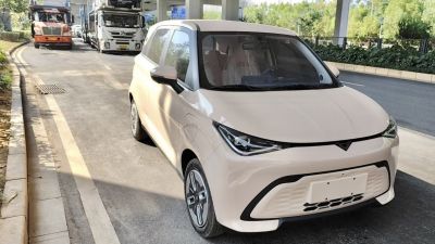 Compact electric hatchback with sleek LED headlights and aerodynamic design