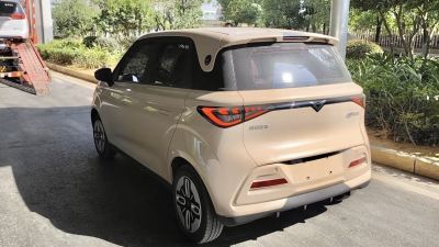 Rear view of compact hatchback with distinctive tail lights and rear spoiler