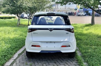 Rear view of compact hatchback with modern taillights and black-glass detailing