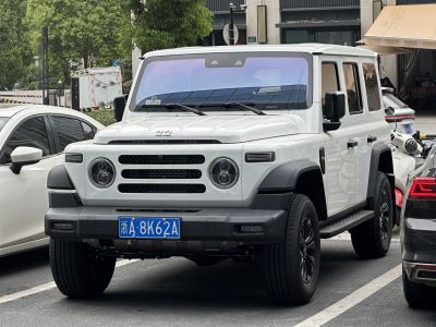 SUV front view with round LED headlights and bold grille