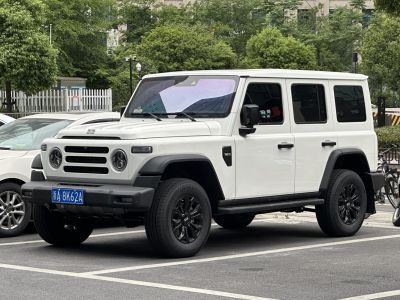 Boxy 4-door SUV with round headlights and black wheels