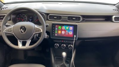 Modern car interior with touchscreen infotainment and multifunction steering wheel