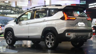 White SUV rear-side view with LED tail lights and roof rails
