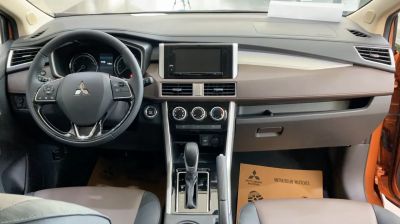 Dashboard, steering wheel, and center console with gear shift and climate controls