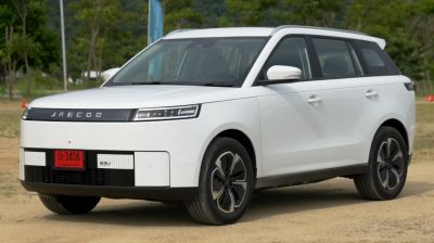White electric SUV with slim LED headlights and aerodynamic wheels