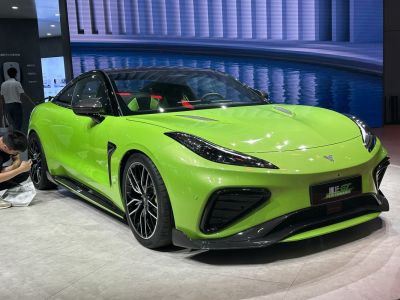 Sporty green coupe with aerodynamic vents and black accents