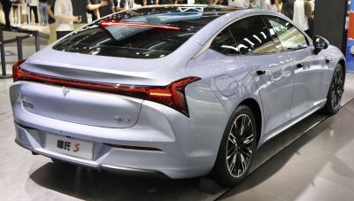 Rear view with full-width LED taillight bar and aerodynamic rear design.