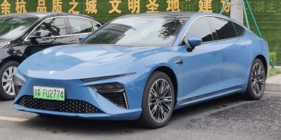 Electric sedan with slim headlights and aerodynamic body design