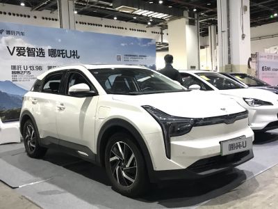Front three-quarter view of electric SUV with vertical LED headlights