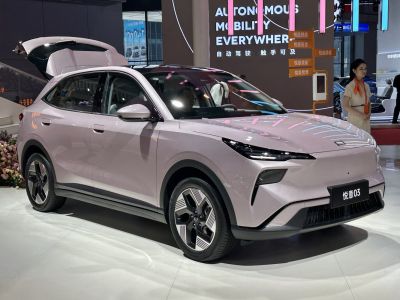 Front and side view of sleek modern SUV with open hatch