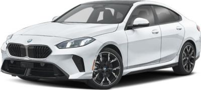 Front-side view of white sporty sedan with kidney grille and alloy wheels