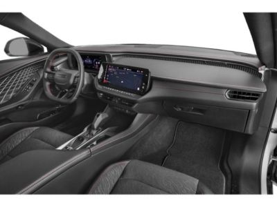 Modern car cabin with digital instrument cluster and touchscreen infotainment system.