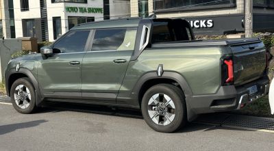 Modern electric double cab pickup with distinctive rear LED lights