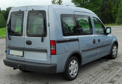 Rear and side view of a five-door compact van with square windows and robust bumper