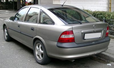 Rear three-quarter view of hatchback with distinct tail lights and wheel rims