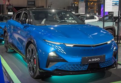 Sleek electric crossover with sharp LED headlights and aerodynamic front design