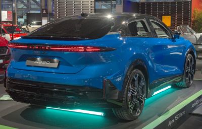 Rear view of blue electric crossover with distinctive LED taillights and unique wheels