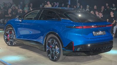 Rear view of electric SUV with futuristic LED taillights and unique wheel design