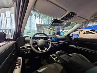 Futuristic car interior with digital displays and sleek black dashboard