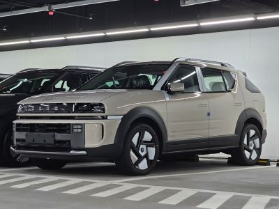 Futuristic front and side view of an SUV with unique LED lights and aerodynamic design