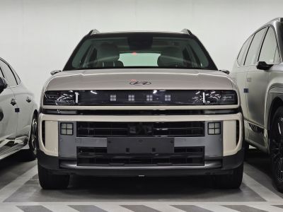 Modern front grille with distinct LED headlights design.