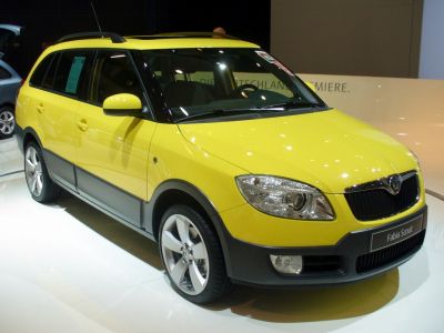 Yellow compact wagon with roof rails and alloy wheels