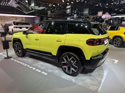 Rear three-quarter view and taillights of an SUV in lime green.