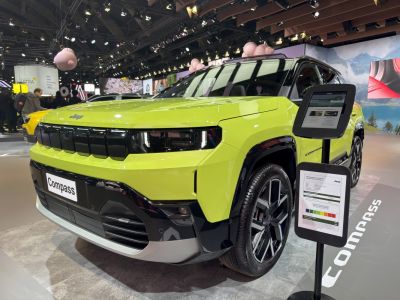 Front grille and alloy wheel design of lime green SUV