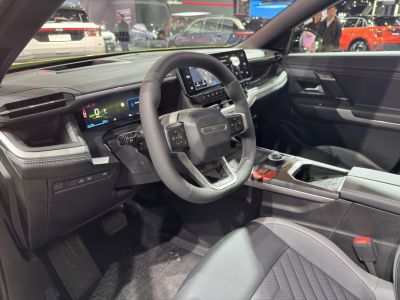 Modern digital dashboard and sleek steering wheel with center console