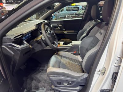Premium leather seats and digital instrument cluster inside a modern SUV interior