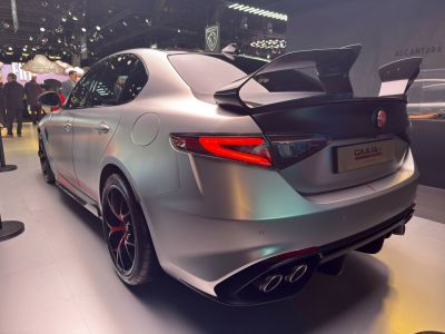 Rear view with large carbon fiber wing and quad exhaust tips
